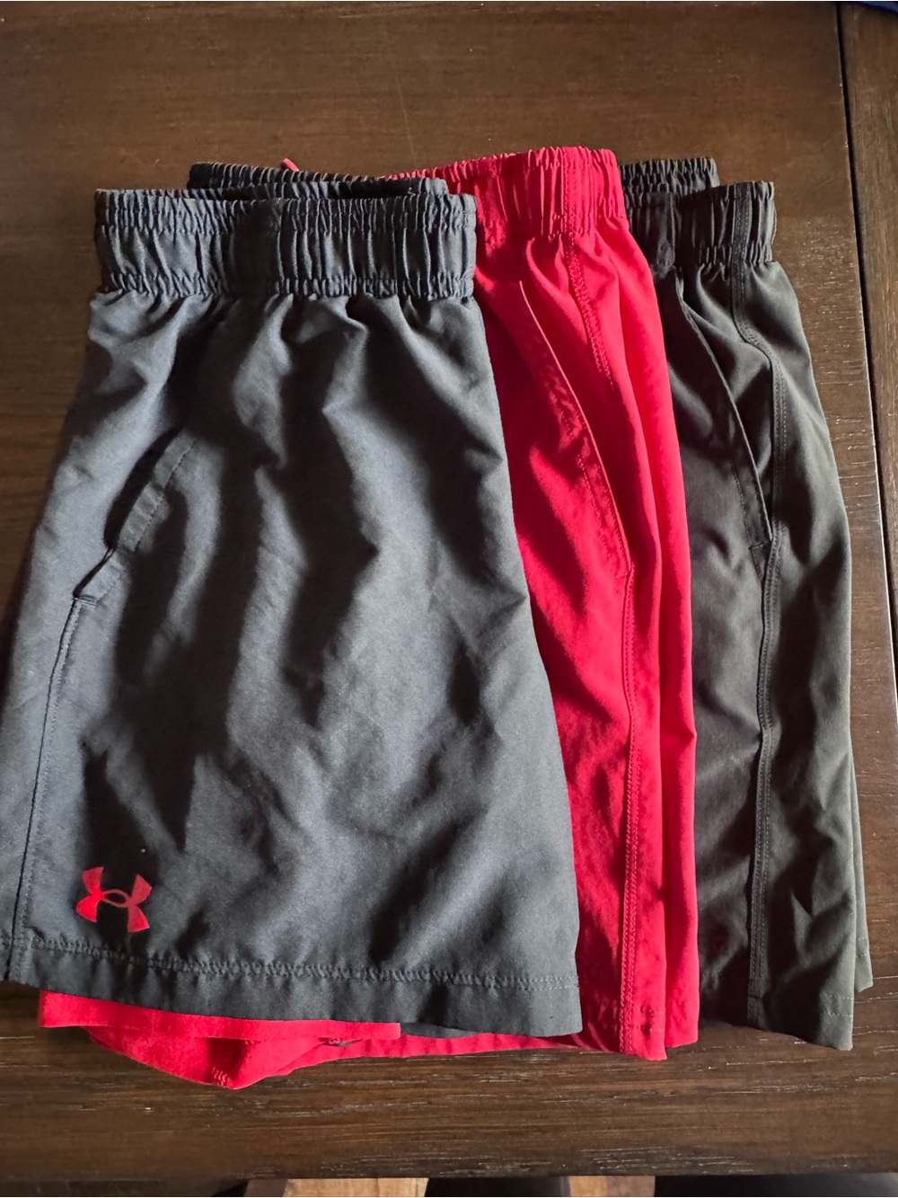 3 pairs of boys shorts. DSG & UA. Size Medium